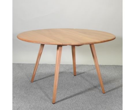 An Ercol light elm drop leaf dining table, 124 x 110cm