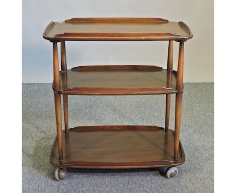 A 1970's Ercol elm three tier drinks trolley, 72cm