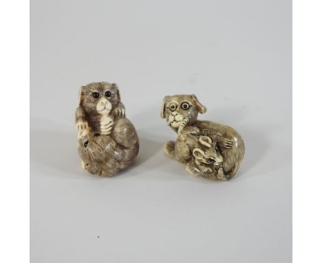 A netsuke, in the form of a dog and a mouse, together with another, 4cm high