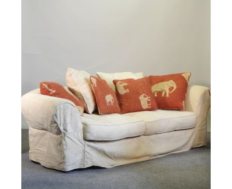 A cream upholstered sofa, with a curved back, by Collins &amp; Hayes, 230cm