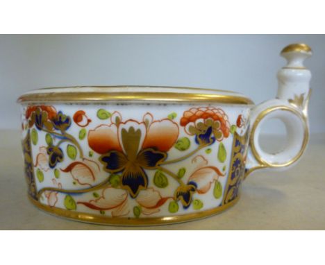A mid 19thC Derby porcelain circular inkstand, decorated in the Imari palette, having a central reservoir aperture and five f