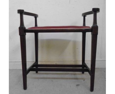 An Edwardian string inlaid mahogany framed stool, having low S-scrolled, open, level arms and a braided, pink dralon upholste