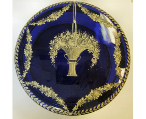 A mid/late 19thC semi-opaque, blue glass powder pot, the cover decorated in white enamel with a flower filled basket and othe