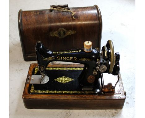 A vintage oak-cased Singer sewing machine.