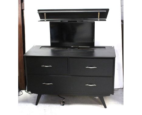 A vintage Remploy dressing table, now painted black, with electrically operated rising LG flat screen TV.