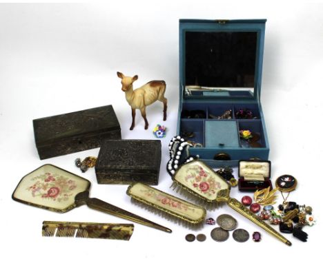 Two Oriental metal jewellery boxes; one lined with shell pink silk, containing a small quantity of coins, Victorian florins d