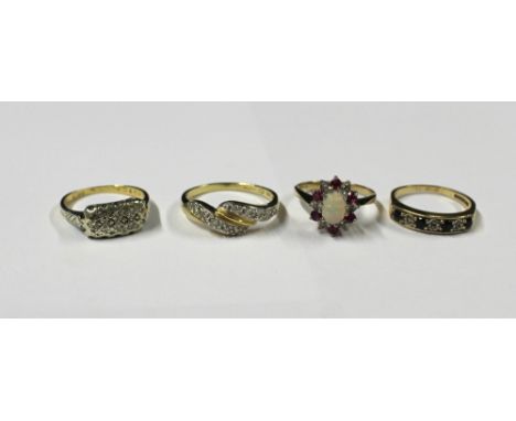 Four ladies' 9ct gold dress rings; a floral-set ring with central opal and red and white stones, size J, a half-eternity ring