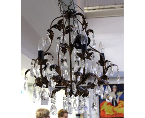 A five-branch ornate electrolier bronze-effect leaf decoration and cut glass drops, 60cm.