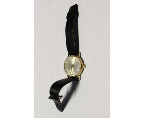 Garrard; a gentlemen's yellow metal wristwatch, dial set with Arabic numerals and date aperture.   CONDITION REPORT  No inscr