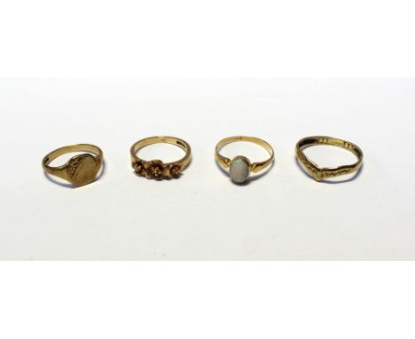 Four 9ct gold dress rings; a wishbone-style ring, size P, one set with single oval opal, a signet ring, size K and one with t