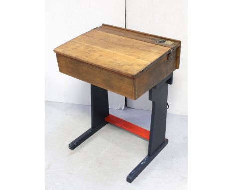 A vintage oak school desk, the brass inkwell aperture enclosing USB port, width 61cm.