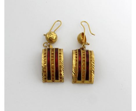 A pair of yellow metal Indian-inspired half-hoop earrings set with red enamel.  CONDITION REPORT Approx 10.1g.