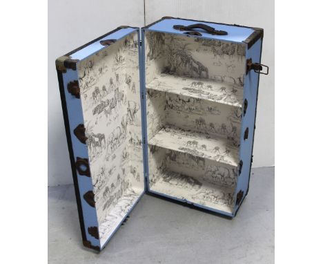 A vintage metal-bound travel trunk, re-painted exterior and re-papered interior, suitable for a child's toybox.
