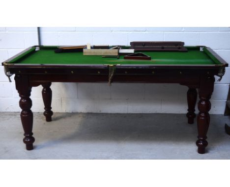 A Riley Ltd home billiards table, slate bed and green baize, raised on mahogany frame with turned supports, height approx 85c