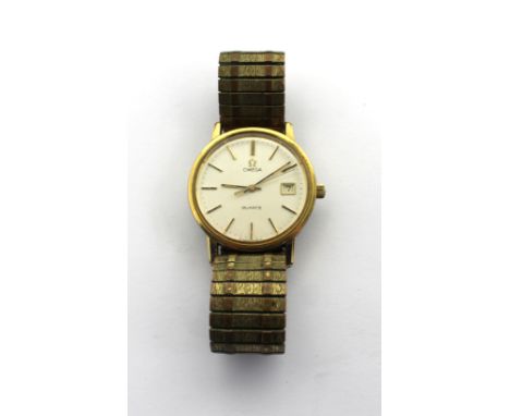 Omega; a yellow metal gentlemen's wristwatch, the silvered dial set with baton numerals and date aperture, on an expandable b