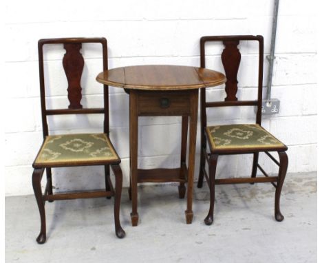 A pair of Edwardian mahogany bedroom chairs and an early 20th century small drop-leaf side table, one drawer over small shelf