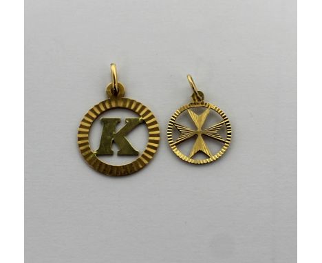 An 18ct gold pendant with letter 'K' in a circle and a 10ct gold pendant with a cross in a circle, approx combined 3g (2).