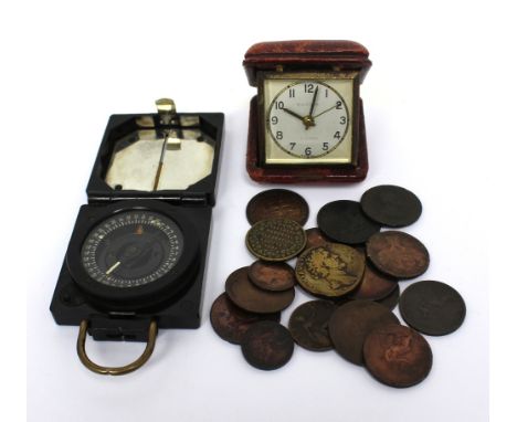 A 20th century military-issue pocket compass, no.B243079, a vintage Europa leather-cased folding travel clock and a selection