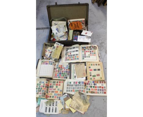A vintage suitcase containing five stamp albums of world stamps and a further quantity of loose stamps. 
