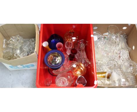 A quantity of vintage glassware to include jugs, rose bowls, vases, retro coloured glass, vintage pressed glass dressing tabl