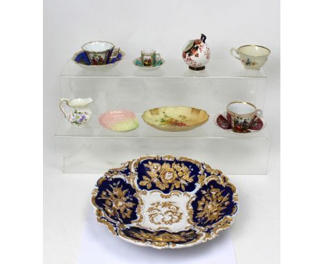 A large 19th century cobalt blue ground bowl, with floral and gilt-heightened decoration, blue crossed swords to base, a quan