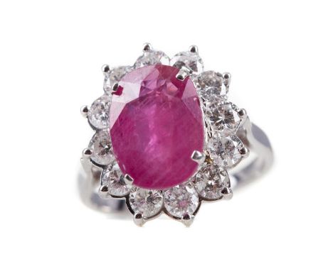 CERTIFICATED RUBY AND DIAMOND RING,the oval ruby of approximately 3.71 carats, with evidence of thermal enhancement, within a