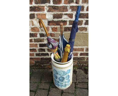 Ceramic umbrella stand with assorted umbrellas