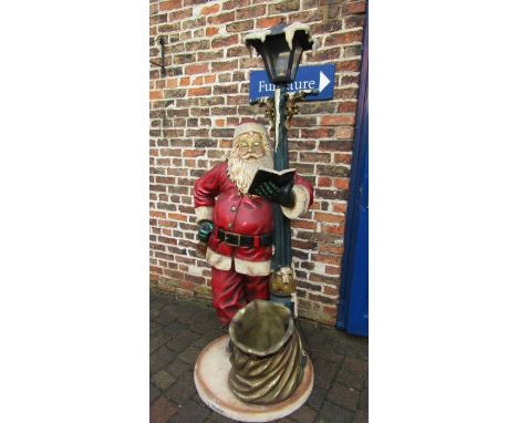 Life size Santa Claus standing under a lamppost light (light fitting loose), 200cm tall