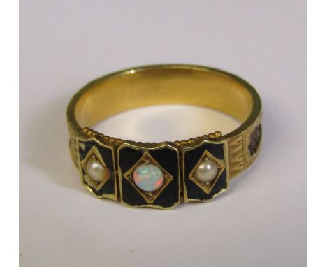 Tested as possibly 15ct gold Victorian mourning ring, decorated with black enamel, seed pearls, mother of pearls and plaited 