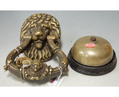 An early 20th century  cast brass lion mask door knocker together with a brass bell (2) Condition Report / Extra Information 