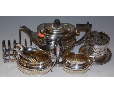A George III style silver plated three piece tea service; together with a silver toast-rack; silver cruet etc 