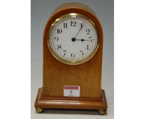 An Edwardian mahogany cased mantel clock having an enamel dial with Arabic numerals and cylinder movement