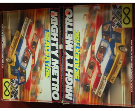 Two boxes Scalextric Mighty Metro slot racing boxed sets, both numbered C880