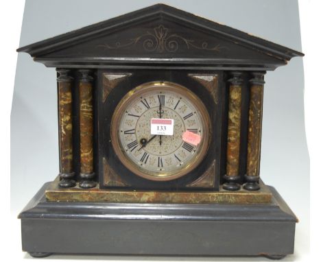 A Victorian faux marble mantel clock of architectural form, having silvered dial with Roman numerals