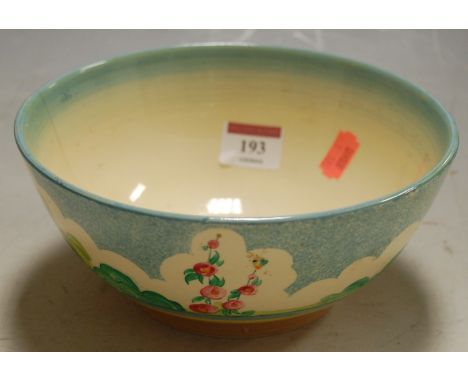 A 1930s Clarice Cliff bowl on a blue ground with floral decoration, printed Clarice Cliff Wilkinson backstamp verso