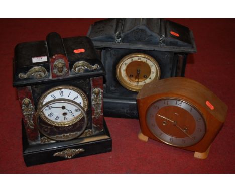 An Edwardian slate mantel clock of architectural form; together with two others (3)