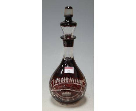 A mid 20th century Bohemian style ruby overlaid glass decanter and stopper
