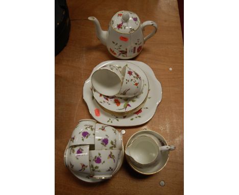 A mid-20th century Crown Staffordshire six place setting tea service, decorated with birds amongst foliage 