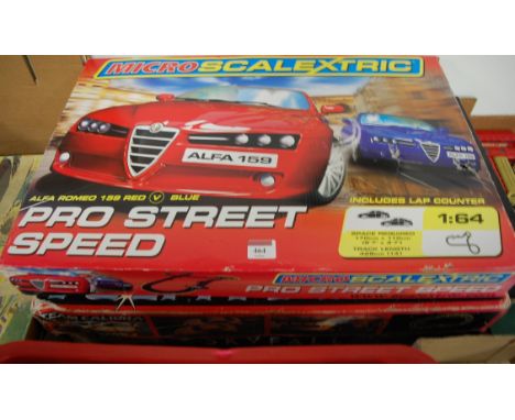 Three boxed Scalextric and Micro Scalextric racing sets to include Skyfall, Team Calibre, and Pro-Street Speed