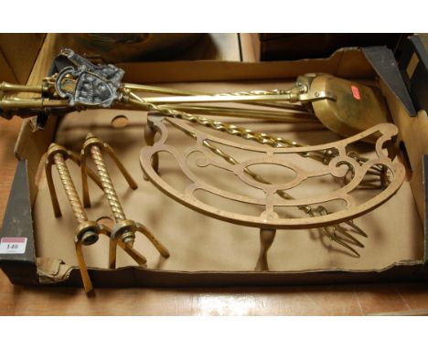 A collection of metalware to include; turned brass fire tools, brass trivet and toasting forks etc