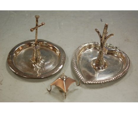 An early 20th century silver ring tree in the form of a lantern (a/f); together with one other silver heart shaped ring tree 