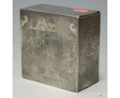 A 20th century Eastern pewter tea caddy of rectangular form with engraved decoration having sliding lid