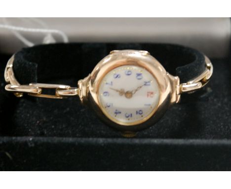 A ladies 9ct gold cased bracelet watch having white enamel dial Condition Report / Extra Information Light surface scratches 