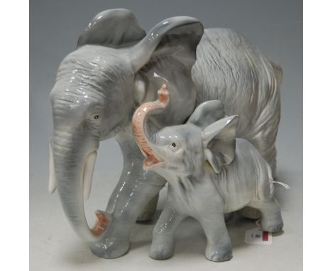 A large ceramic model of an elephant and calf