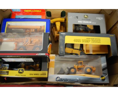 A collection of modern issue construction related diecast vehicles to include Ertl, John Deere 850 J crawler tractor