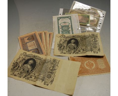 A collection of assorted 19th century and later banknotes to include; Russian roubles, Indonesian Lima rupiah, Chilean pesos 