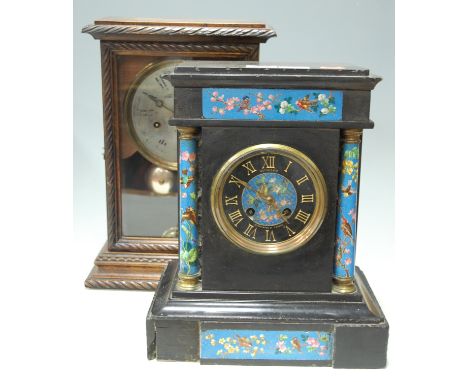 A late Victorian black slate and porcelain inset mantel clock, the porcelain dial with matt chapter ring and gilt Roman numer