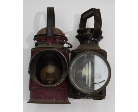 Two vintage Railway Handlamps, one stamped 'BR' to body, in original black and essentially complete with oil lantern and clea