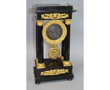 An ebony and gilt portico clock H.40cm