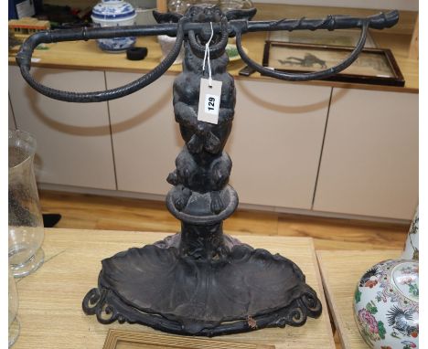 A Victorian cast iron dog and whip stick stand height 60cm